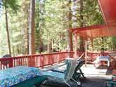 This Yosemite vacation rental has a huge family deck overlooking the Merced River