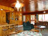 Large family dinner table in the dining area of this beautiful Yosemite National Park Rental Cabin